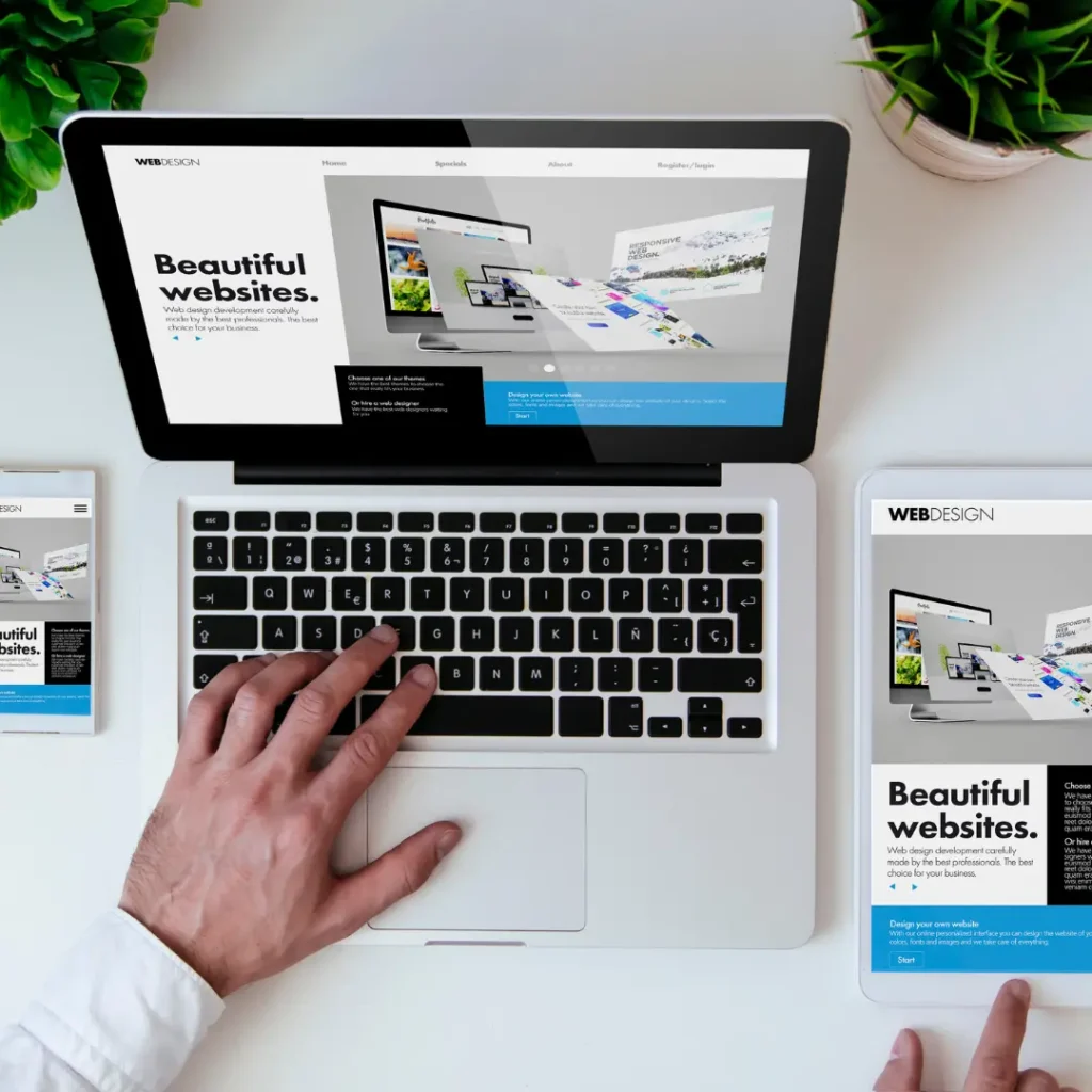 A person pulling up the same website across laptop, tablet, and mobile to demonstrate responsive web design