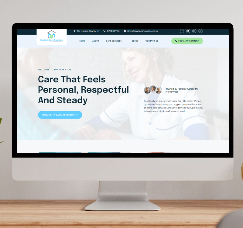 A desktop monitor displaying the Dav Mak Care Solutions website homepage, featuring a professional caregiver background and a call to action for a care assessment.