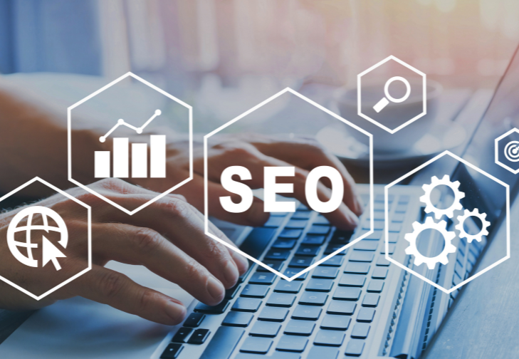 Hands typing on a laptop keyboard with SEO icons and analytics symbols overlaid on the screen.