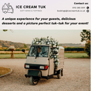 Small ice cream tuk parked outdoors at an event venue, decorated with flowers and ready to serve desserts.
