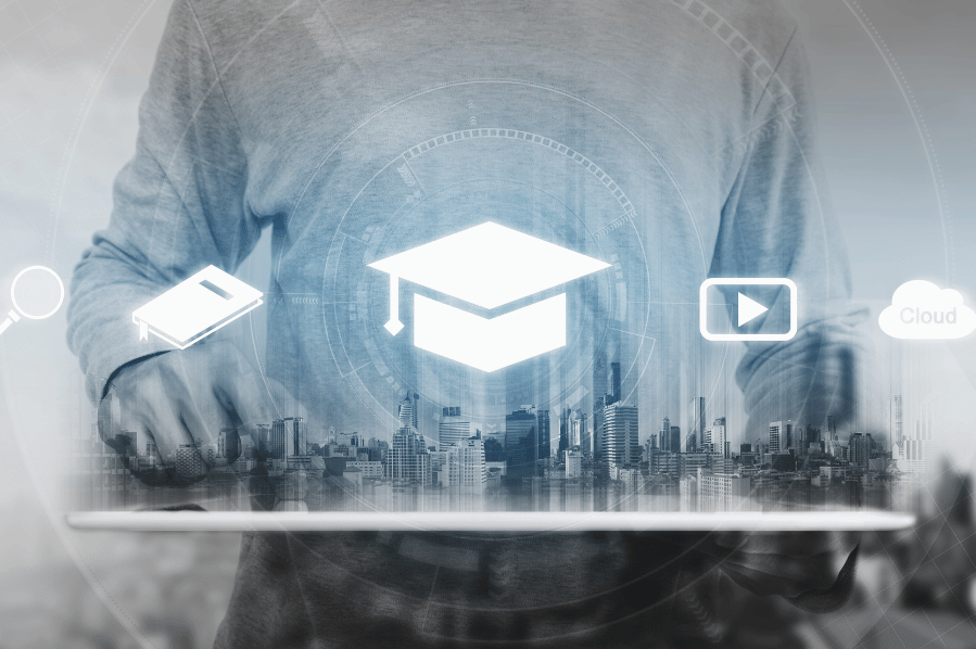 Person holding a tablet with a digital graduation cap and online learning icons.