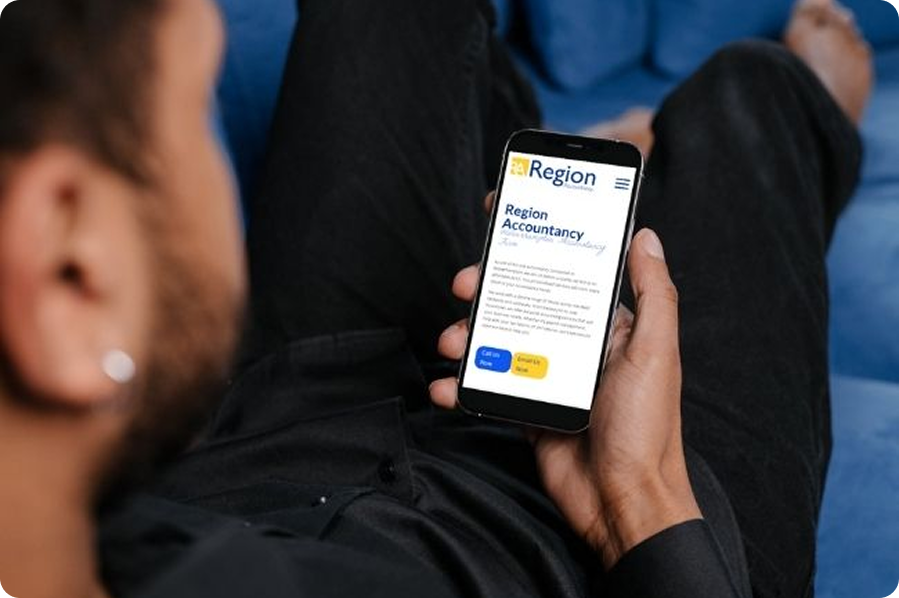 Person viewing the Region Accountancy website on a smartphone