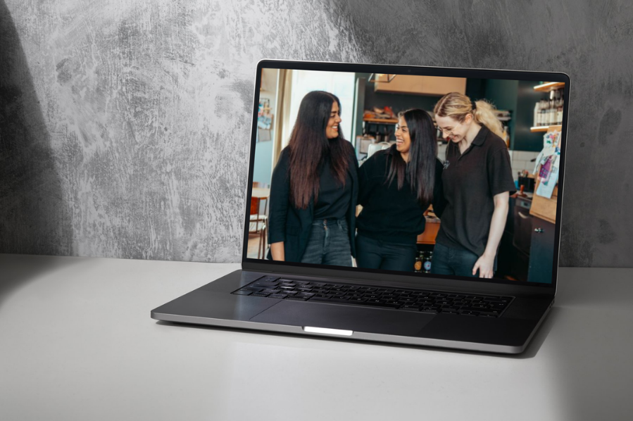 Desktop computer displaying the Vertikal Group creative website, representing industry-focused marketing and digital website design solutions for events and entertainment brands.