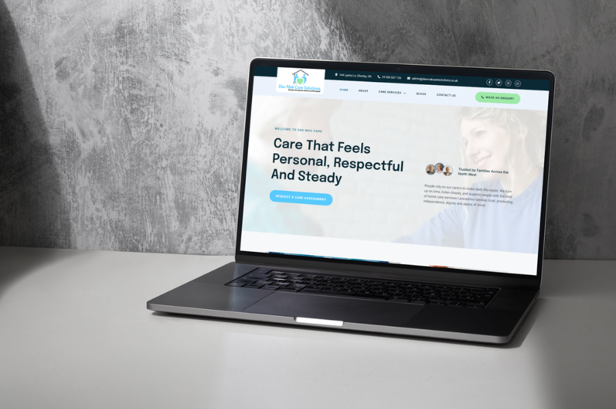 Desktop computer displaying the Day Max Care Solutions website for care and community marketing in the UK.