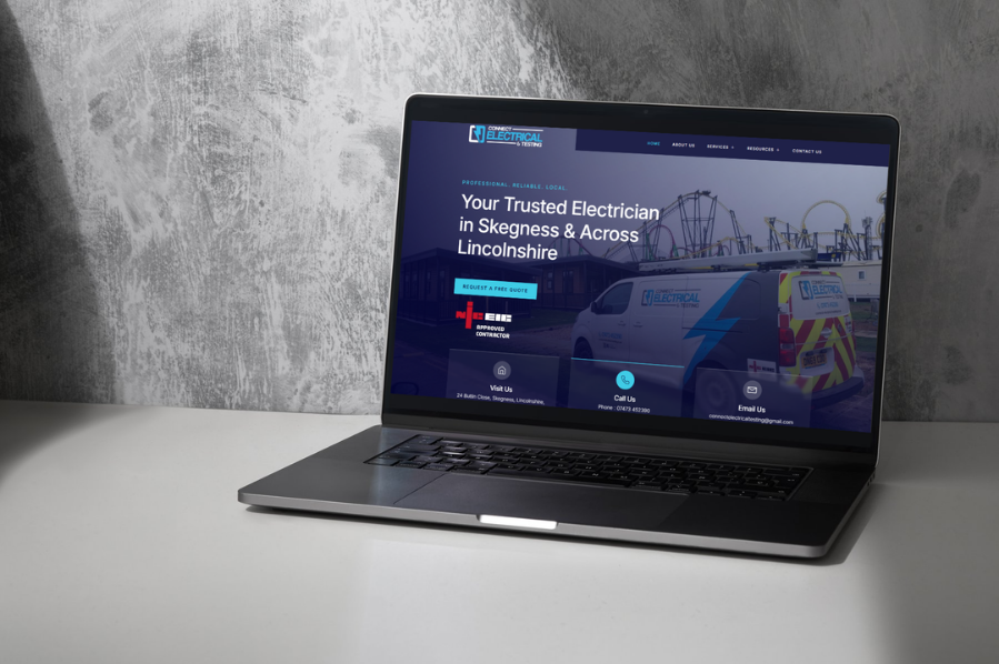 Desktop computer displaying the Connect Electrical & Testing website, representing construction company marketing and industry-focused website design solutions for electrical service businesses.
