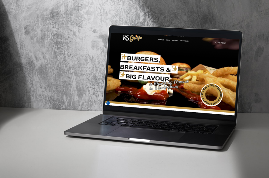 Desktop computer displaying the KS Grillz restaurant website, representing hospitality and leisure industry-focused marketing and website design solutions for food and restaurant businesses.