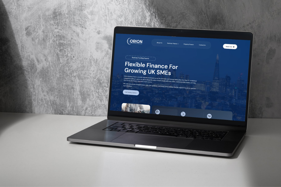Desktop computer displaying the Orion Business Finance website, representing industry-focused marketing and professional website design solutions for finance and business service companies.