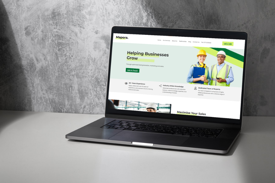 Desktop computer displaying the Mapora business website, representing industry-focused marketing and professional website design solutions for business and consultancy services.