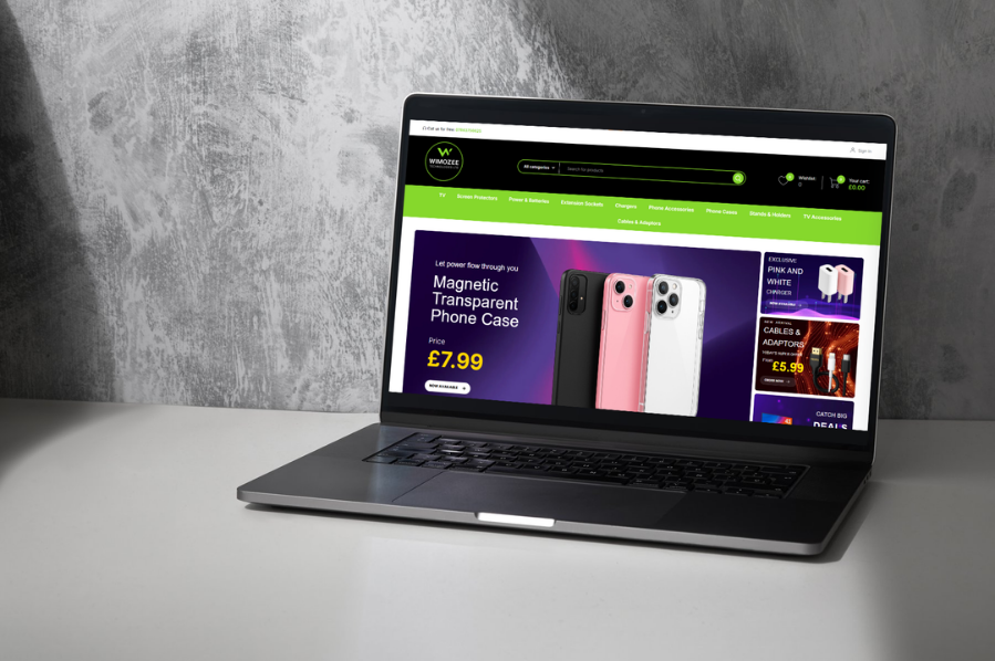 Desktop computer displaying the Wimozee Technologies e-commerce website, representing retail and e-commerce industry-focused marketing and custom website design solutions.